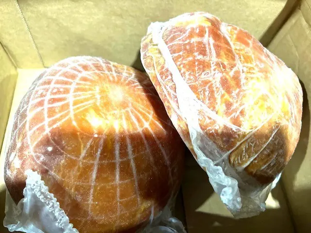 Netted hams in a case